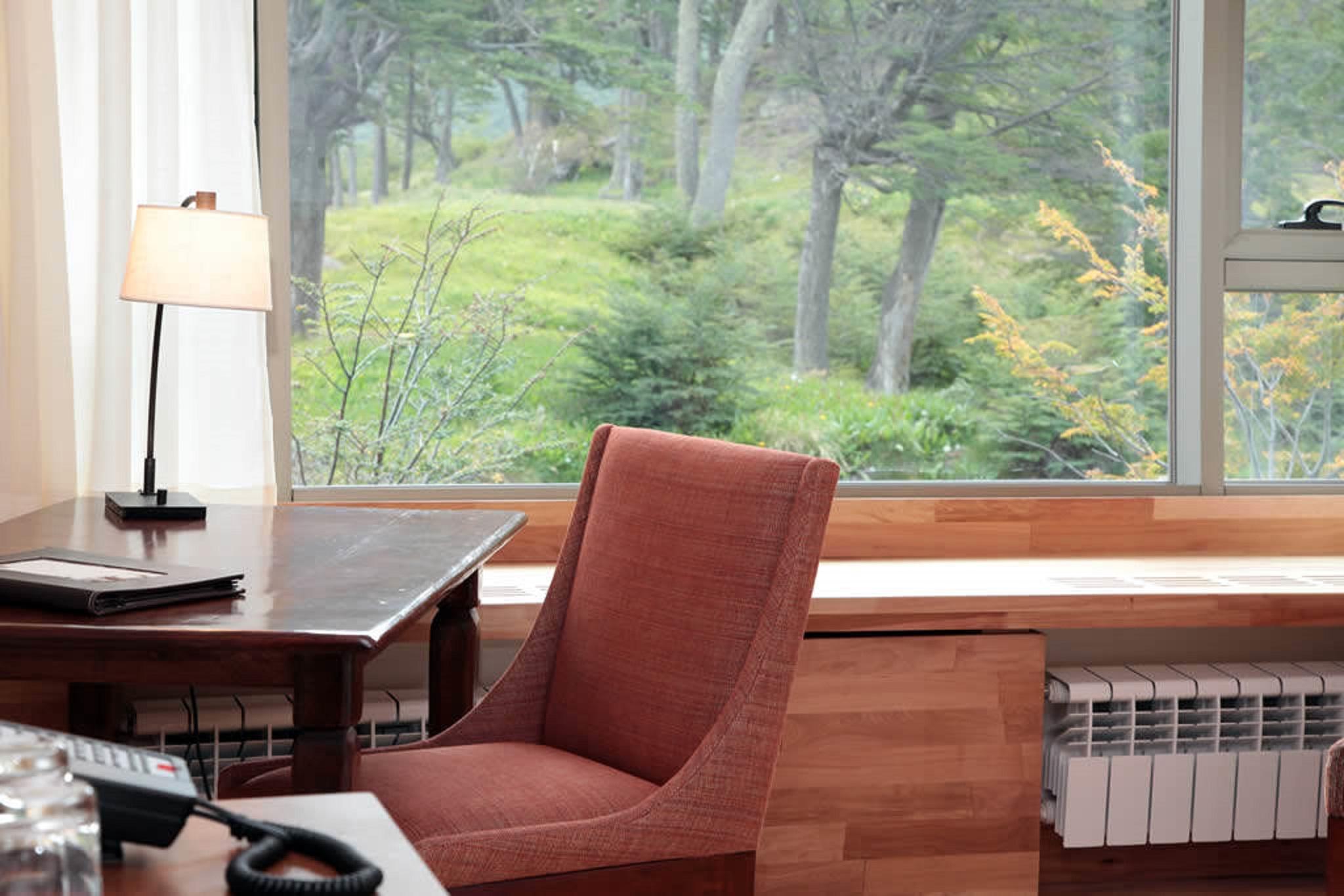 Arakur Ushuaia Resort & Spa Luaran gambar A view of the woods from the library